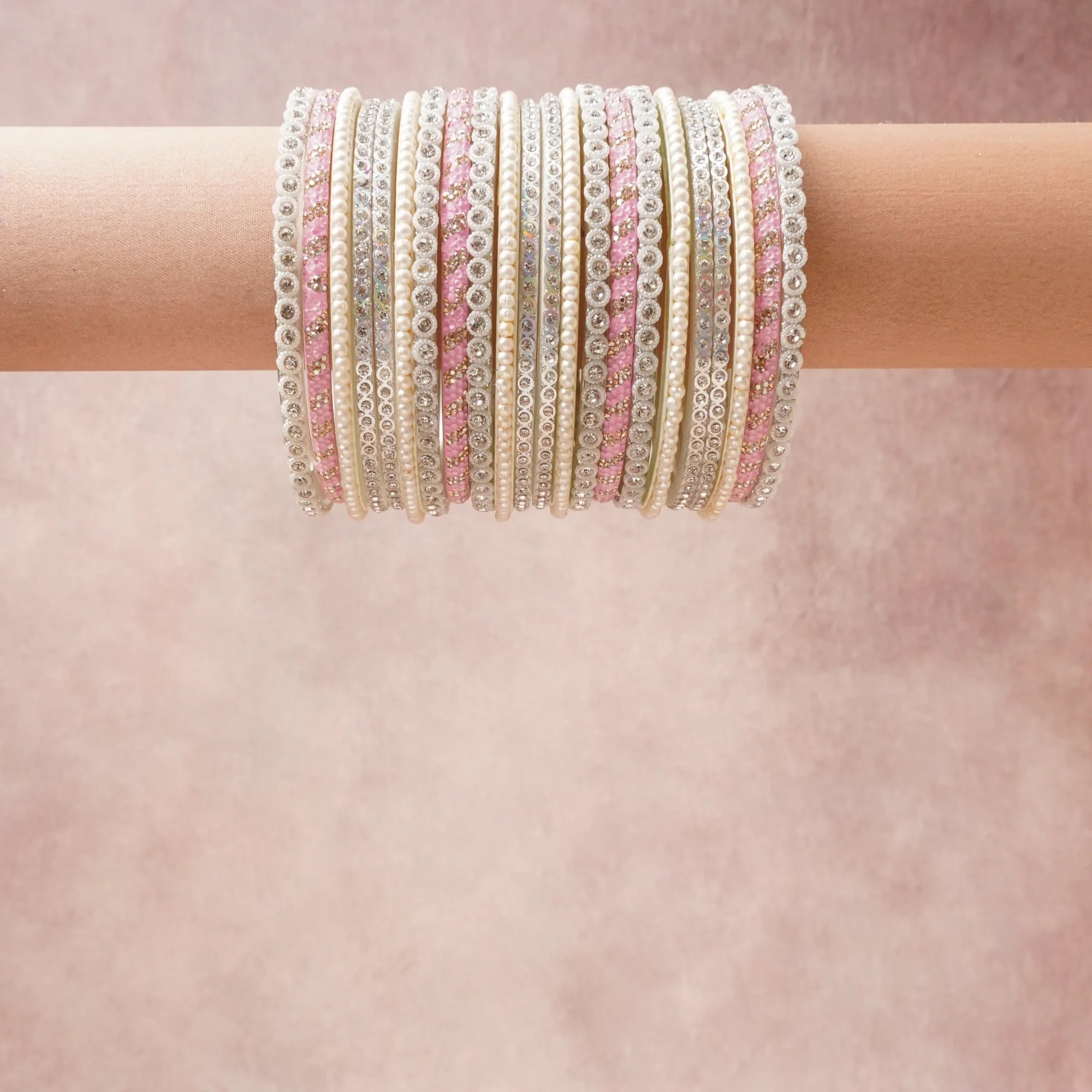 A grounding Silver forms the heart of the set, while touches of Pink add charm.

A thoughtful composition of Pearls, Crystals, Metal, Enamel, designed to feel complete without being heavy.
Each element layers seamlessly, creating a look that is refined, wearable and quietly striking.